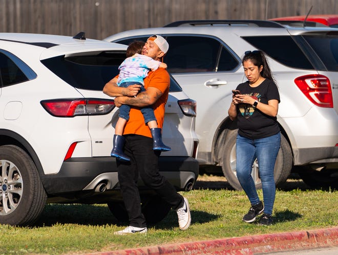 Families reunite with their children at Tom Green Elementary in Buda, Texas after Pre-K students from the school were involved in a bus roll-over crash outside of Austin, Friday, March 22, 2024.